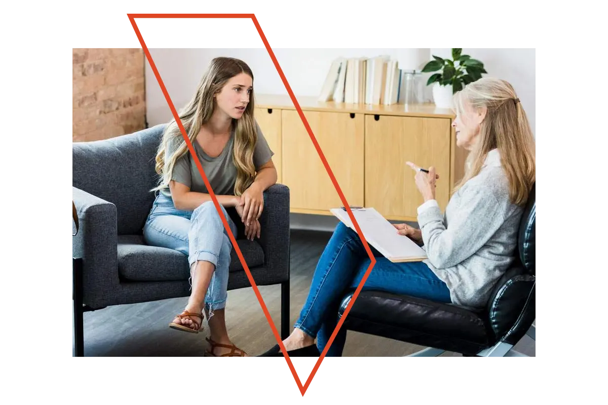 A woman counselling another woman.